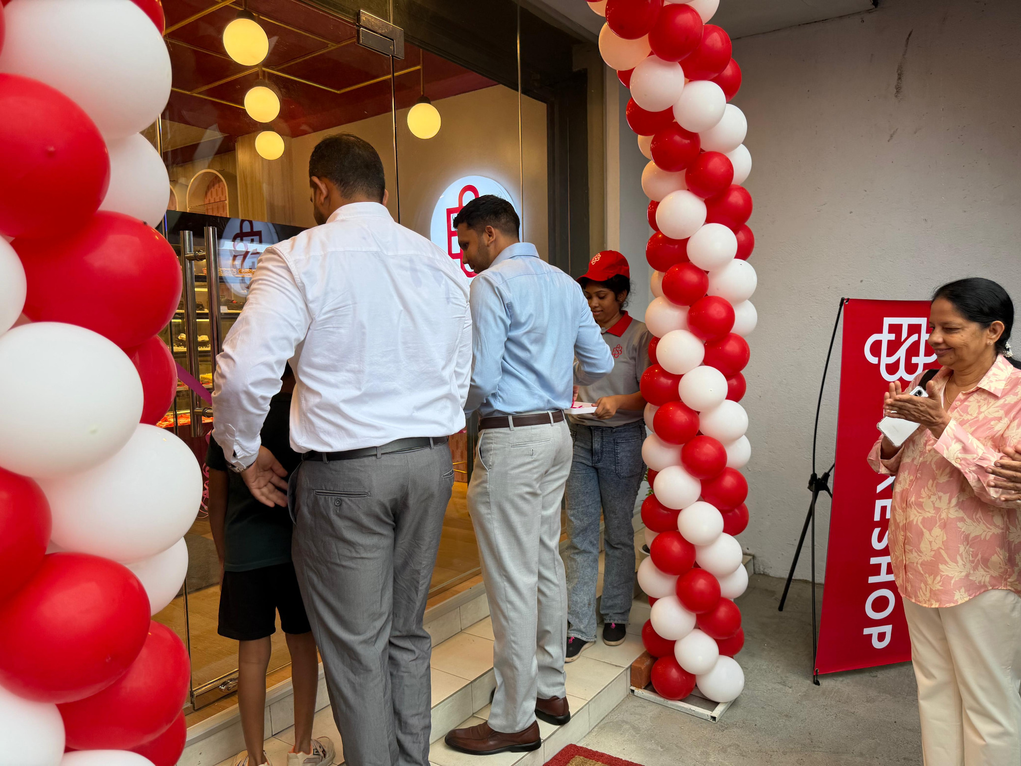 Welcoming guests at the franchise outlet opening